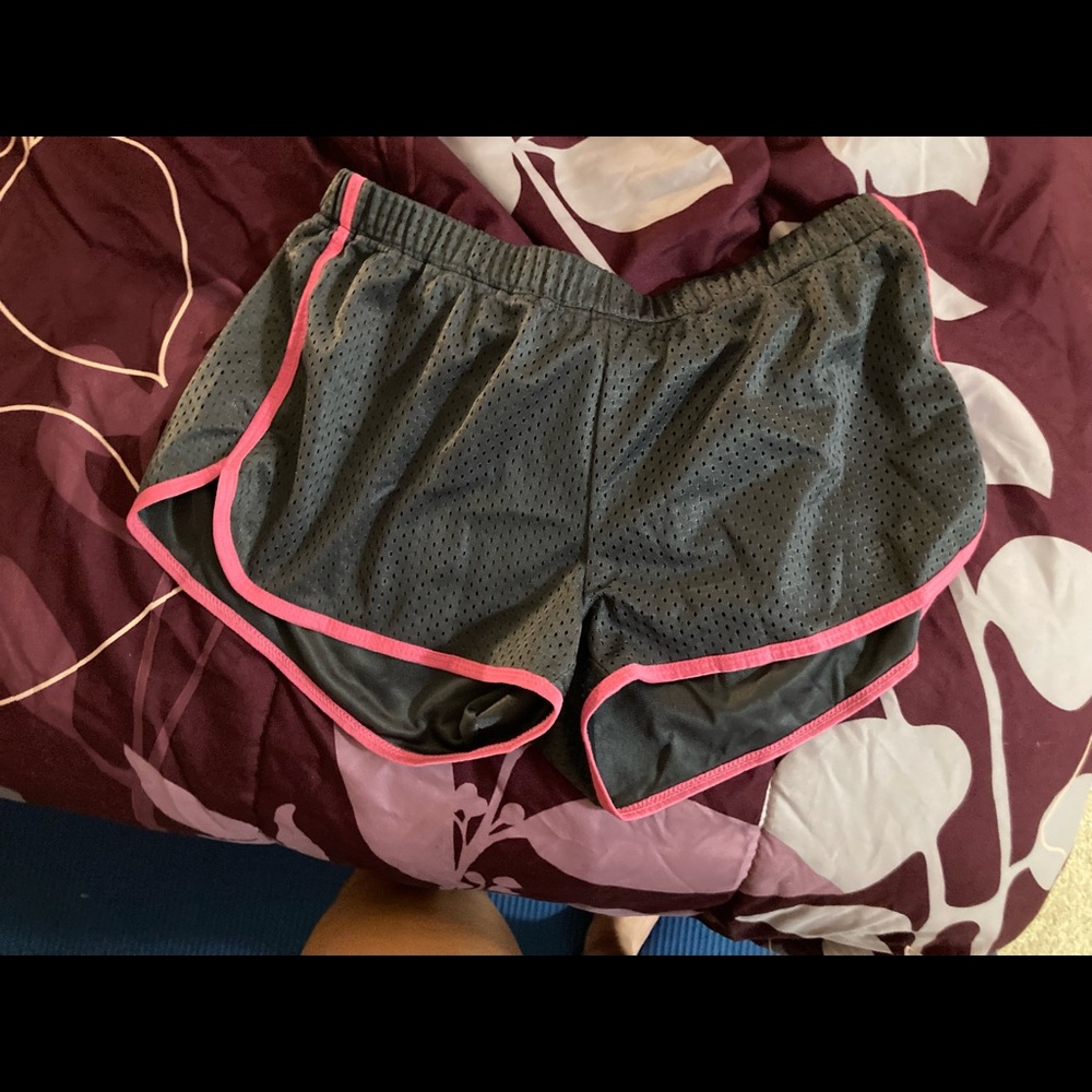 Grey athletic shorts with pink trim